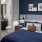 a bedroom with a blue bed