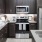 a kitchen with dark cabinets